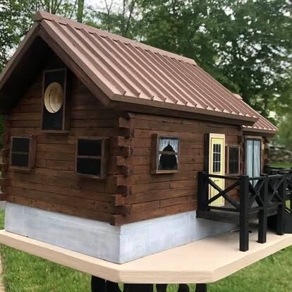 Model replica of a wood cabin.