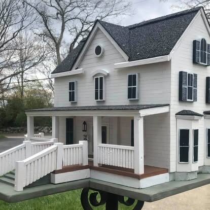 Custom model home replica of White House with steps and front porch.