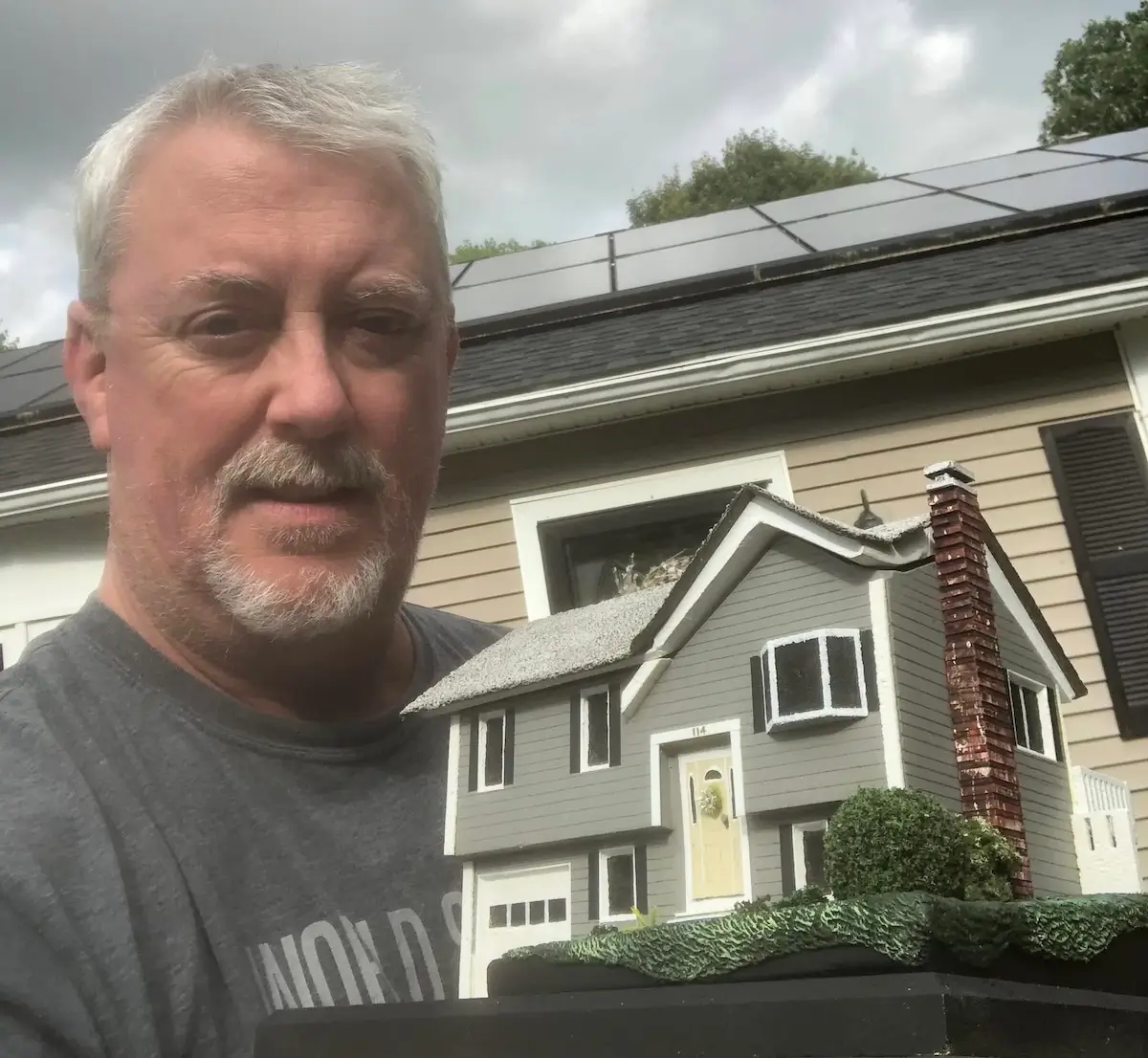 Kevin Coffey, owner of Coffey's Creations, with a recent completed home replica build.